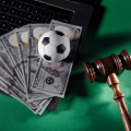 gavel-and-soccer-ball-on-a-pile-of-money